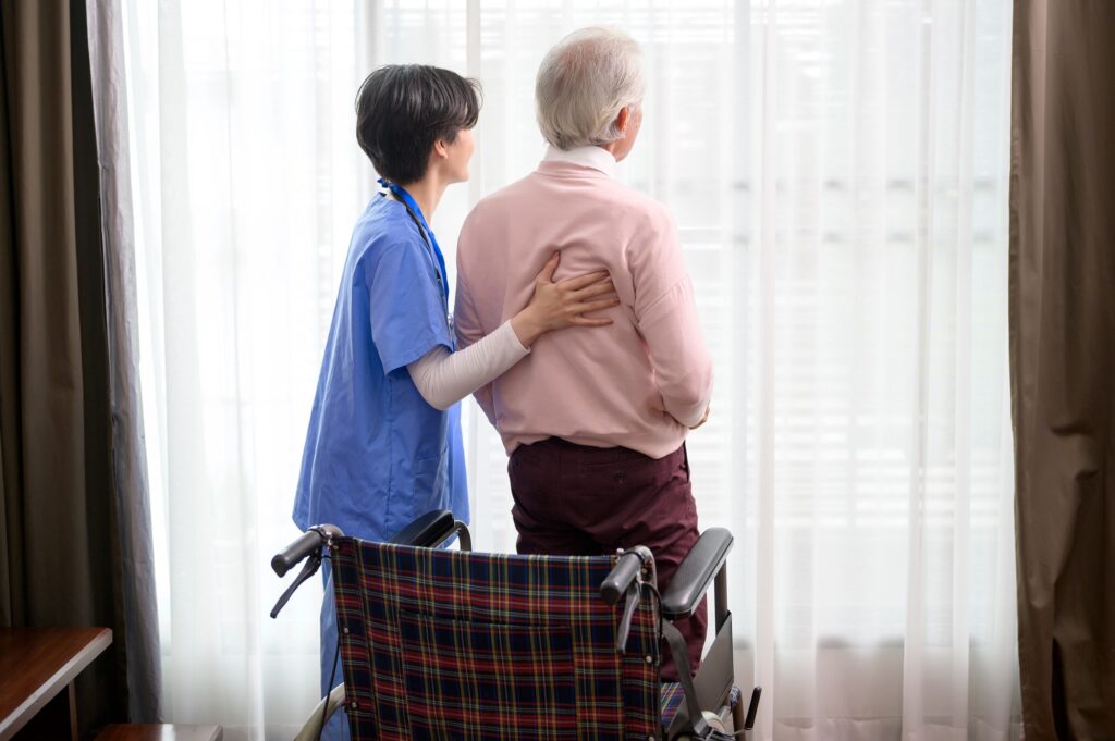 Asian nurse taking care of an elderly man